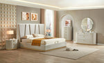Modern bedroom with a large bed, nightstands, and dresser.