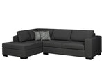 Black sectional sofa with a patterned pillow on a white background