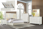 White bedroom furniture set with bed, dressers, and mirror in a room setting.