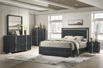 Modern bedroom with dark wood furniture including a bed, dresser, and nightstands.