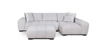 Gray sectional sofa with ottoman on a white background