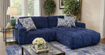 Blue sectional sofa in a living room with decorative pillows and a coffee table.