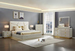 Modern bedroom with a large bed, nightstands, and dresser.
