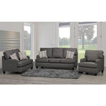 Gray sofa set with patterned cushions in a living room setting.