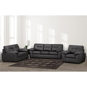 Gray sectional sofa set in a living room with a rug and decor items.