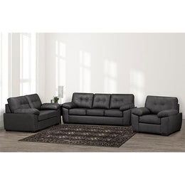 Gray sectional sofa set in a living room with a rug and decor items.