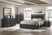 Modern bedroom with dark wood furniture including a bed, dresser, and nightstands.