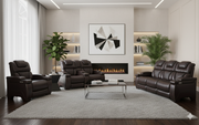 Modern living room with brown leather furniture, a fireplace, and decorative elements.