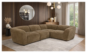 Brown sectional sofa in a living room setting with decor elements.