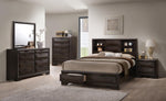 Modern bedroom set with dark wood furniture including a bed, dresser, and nightstands.