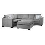 Gray sectional sofa with patterned cushions on a white background