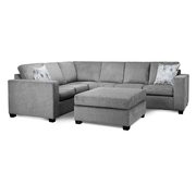 Gray sectional sofa with patterned cushions on a white background